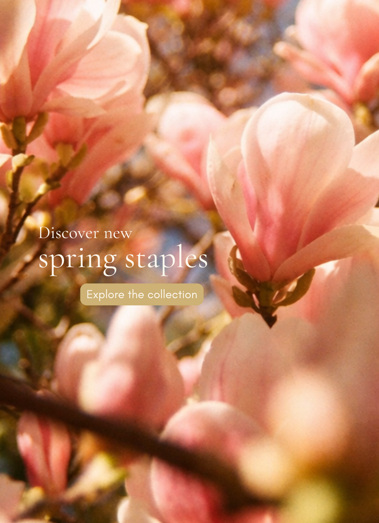 Pink spring blossoms with text “Discover new spring staples – Explore the collection”